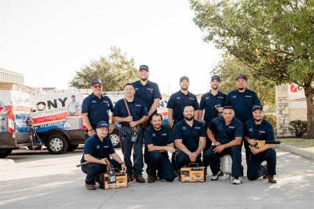 The Colony technician team posing with their tool bags outside the office, ready to serve Little Elm