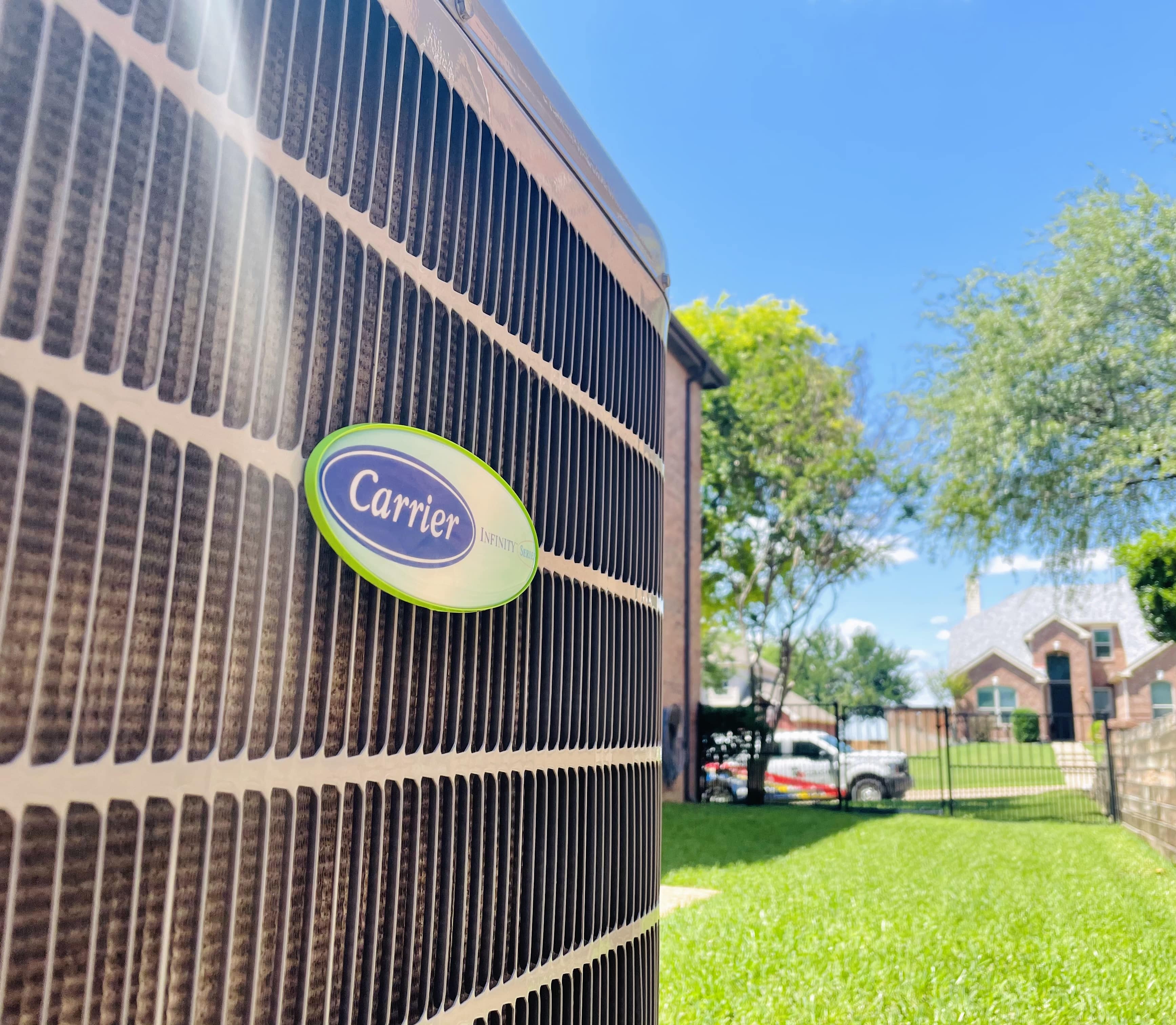 Extreme close up of a Carrier AC outdoor unit in Frisco