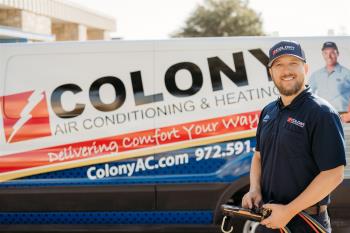 Smiling Colony employee about to perform AC service in Plano
