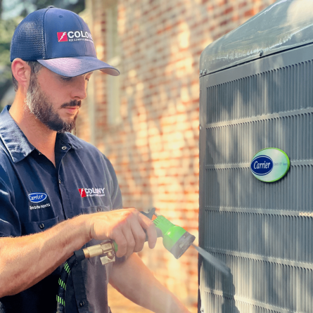 Colony technician servicing a Carrier air conditioner in Frisco