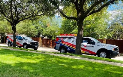 Two Colony trucks in Carrollton for an AC service call.