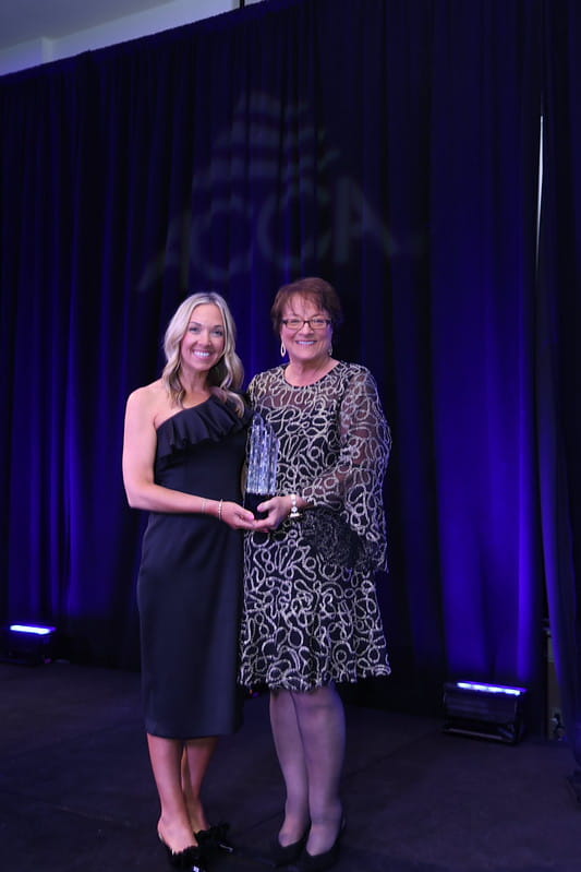 Elaine Rosenthal (Everett) and Kathy Everett accept the ACCA 2026 Contractor of the Year award