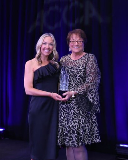 Elaine Rosenthal (Everett) and Kathy Everett accept the ACCA 2026 Contractor of the Year award